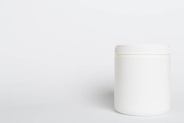 istock Plastic bottle for vitamins on color background 1631873571