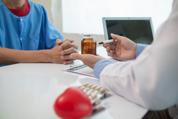 a heart patient visits a medical for advice on health care and medication to treat heart disease symptoms after the medical team has diagnosed and examined the patient for heart abnormalities. - department of health and human services imagens e fotografias de stock