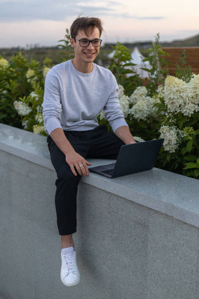 istock A student is working at a laptop in the park. 1631880306