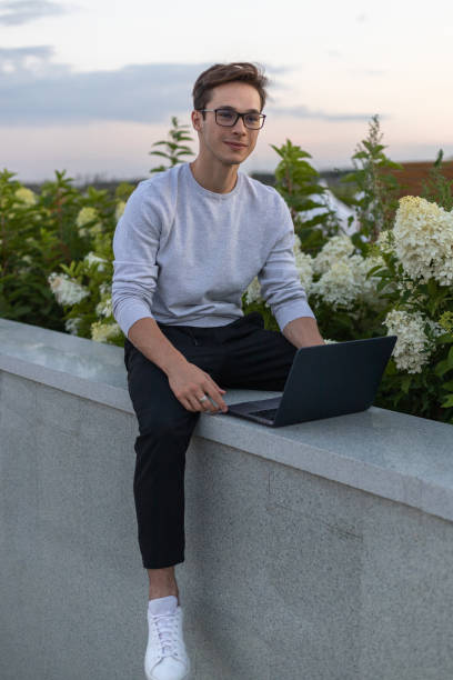 istock A student is working at a laptop in the park. 1631880835