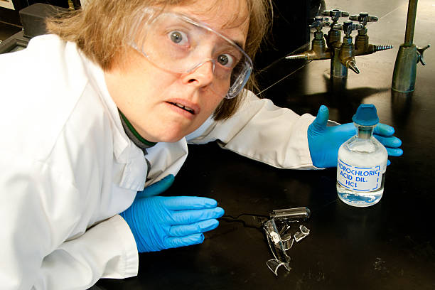 Woman broke a test tube with hydrochloric acid stock photo