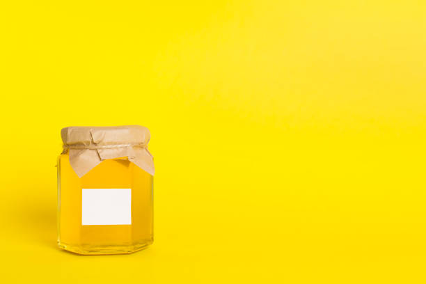 istock Jar with honey on color background. Mock up design 1631884633