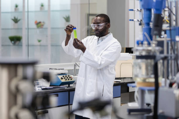 istock Young man works in lab developing wellness supplements for business. 1631902244