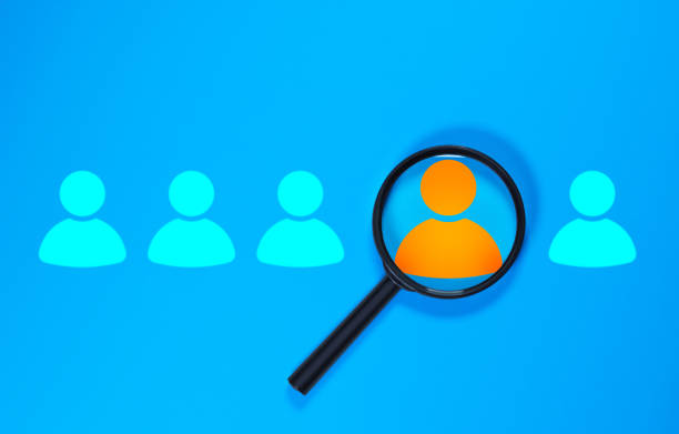 istock Recruiting, hiring concept, real magnifying glass 1631902475