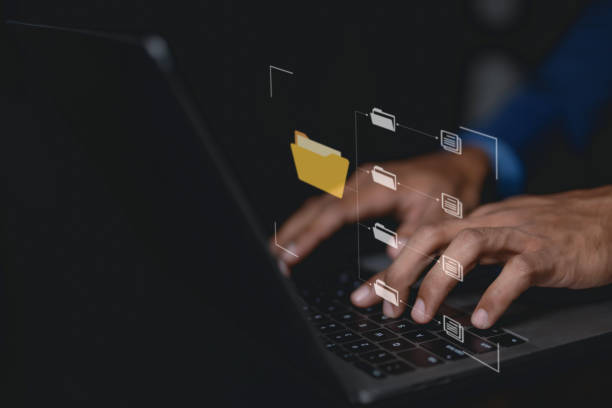 istock Business document icon. Business people using laptop to store documents and search for information. Document management with icons on virtual screen ERP. 1631911530