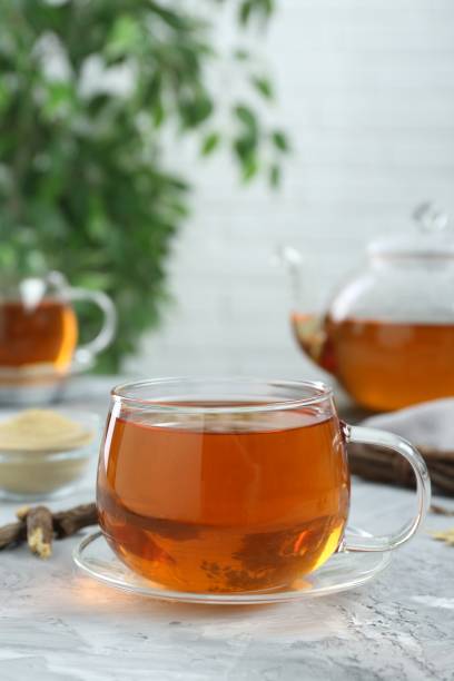 istock Aromatic licorice tea on light gray textured table, space for text 1631951998