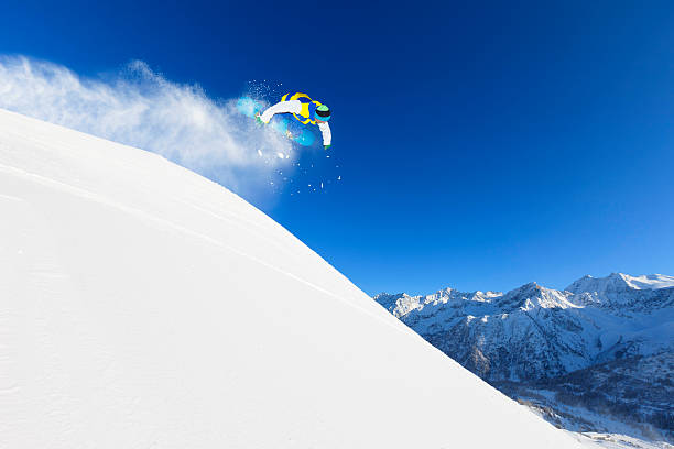 istock Freestyle snowboarder in a jump 163195298