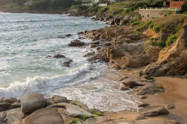 istock waves in the rocks of a beach 1631954714