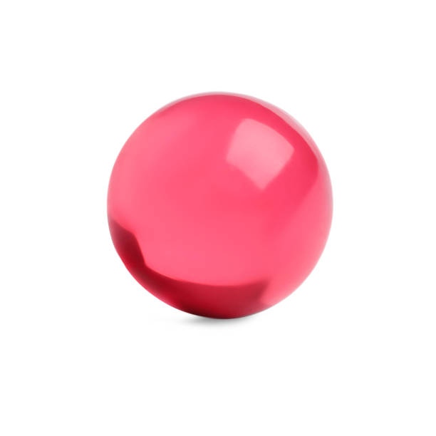 istock One pink pill on white background. Medicinal treatment 1631956879