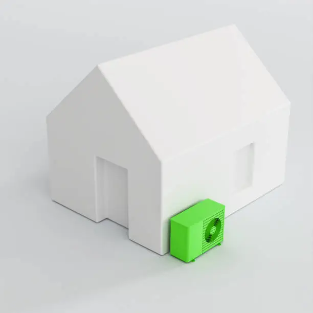 Model home with a green heatpump. Concept for sustainable heating with electric heatpumps.