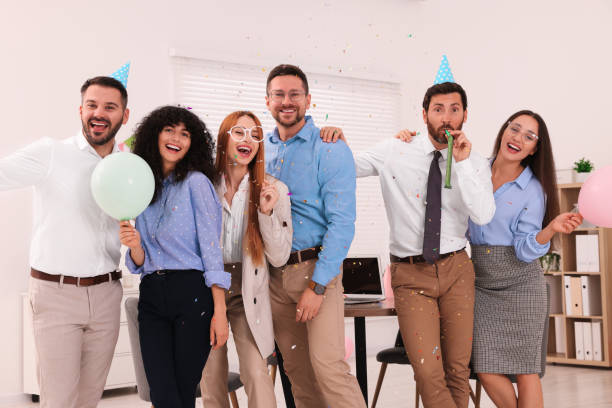 istock Coworkers having fun during office party indoors 1631968121