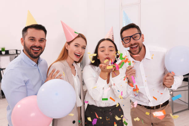 istock Coworkers having fun during office party indoors 1631969234