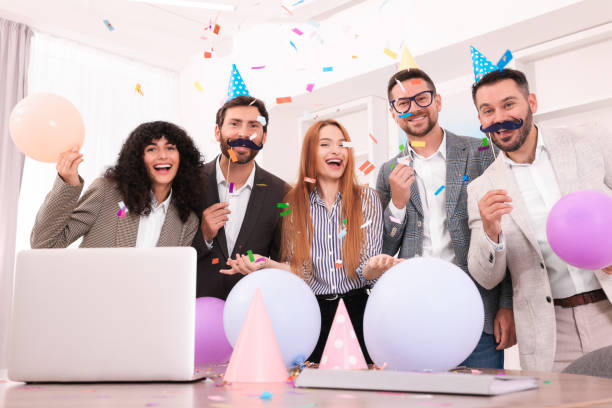 istock Coworkers having fun during office party indoors 1631969253