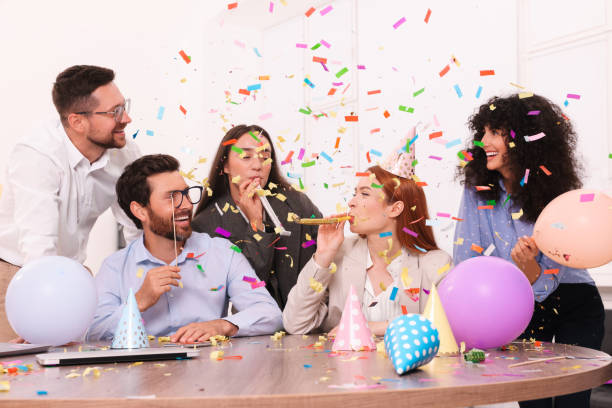 istock Coworkers having fun during office party indoors 1631972661