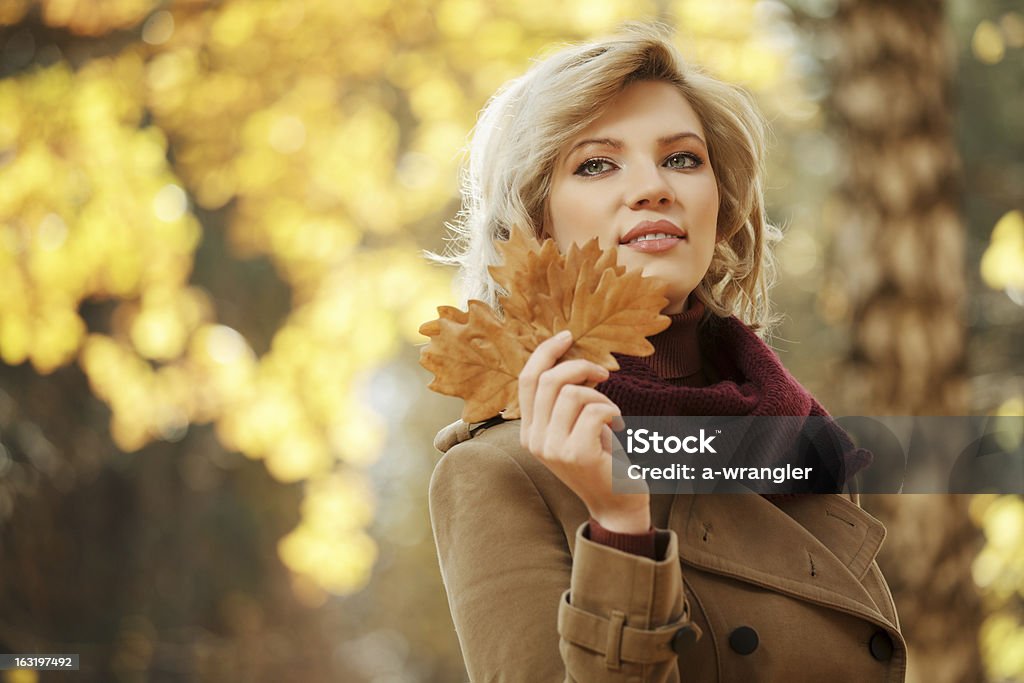 Young woman walking in autumn forest 20-24 Years Stock Photo