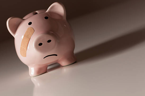istock Piggy Bank with Bandage on Face 163198038