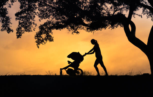 Mother going walk with her baby in the stroller.