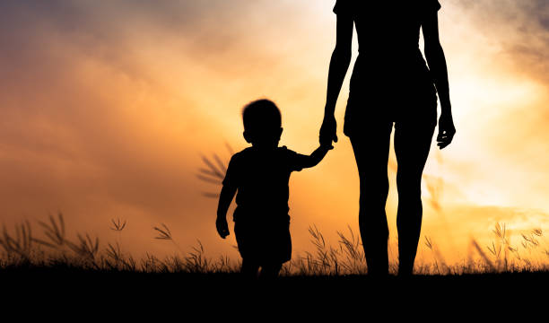 istock Mother and son bonding at sunset. 1632009250