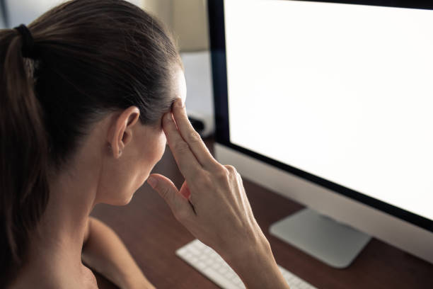 istock Stressed female office worker sitting at computer desk. Overworked woman. 1632009834