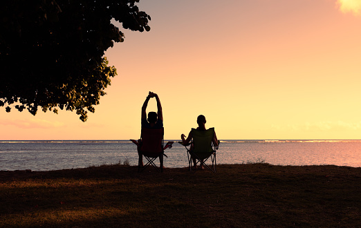 Couple on the beach at sunset.