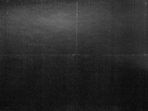 istock top shot photo of paper with dark printer ink on it and small folding marks. 1632010949