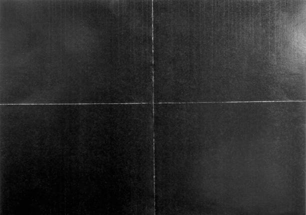 istock top shot of paper with dark printer ink on it and folding marks. 1632010952