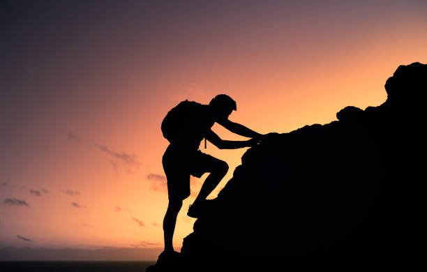 istock Men hiker climbing up the mountain. 1632011544