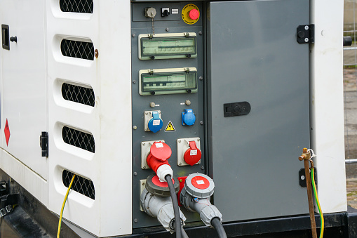 Fragment of the control panel of the mobile diesel fuel charging generator connected to provide power for the outdoor event