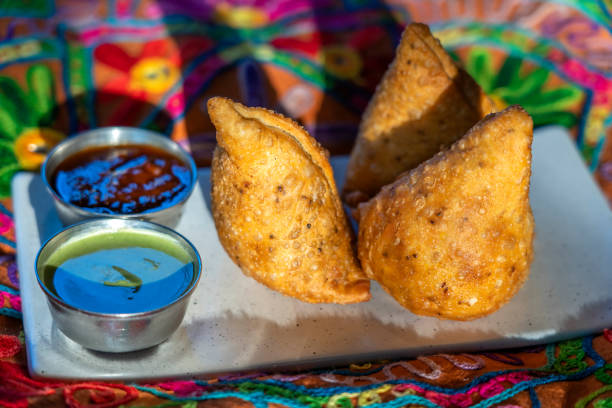 istock Vegetarian samosas with sauces. Fried potato samosa in plate. Indian cuisine 1632017084