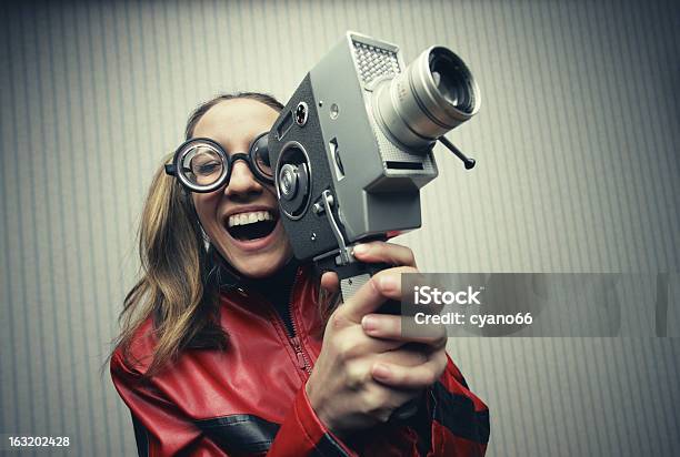 Laughing Woman Filming Movie With Vintage Video Camera Stock Photo - Download Image Now