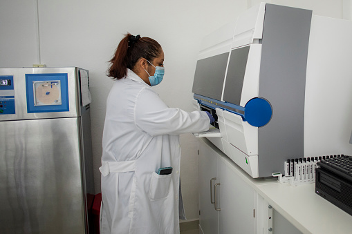Laboratory personnel analyzing blood
