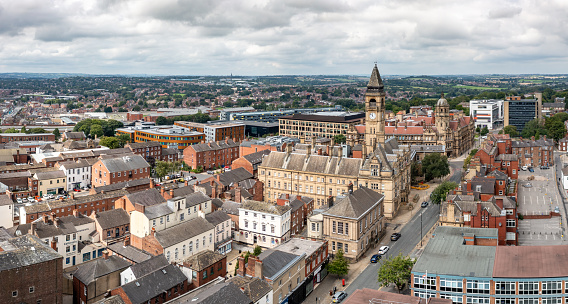Wakefield, UK - August 17, 2023.  An aerial panoramic view of a Wakefield cityscape skyline in the town centre with the Town Hall and County Hall buildings prominent