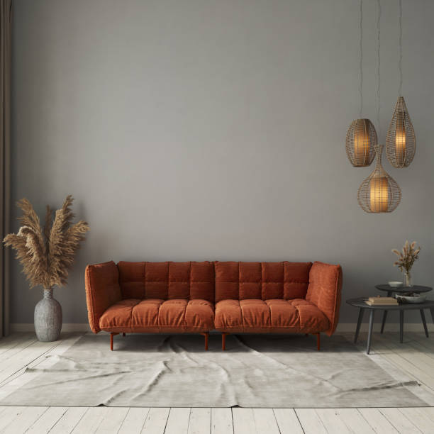 istock Living room interior with orange sofa on gray concrete wall background. Interior mockup, 3d render 1632050879