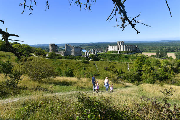 Les Andelys, France-08 21 2023: People on the path leading to the ruins of Chateau Gaillard in Les Andelys, Normandy, France.