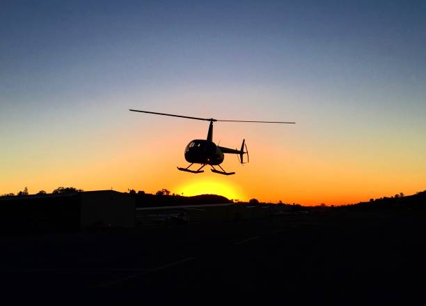 istock Helicopter Landing on the Sunset 1632102221
