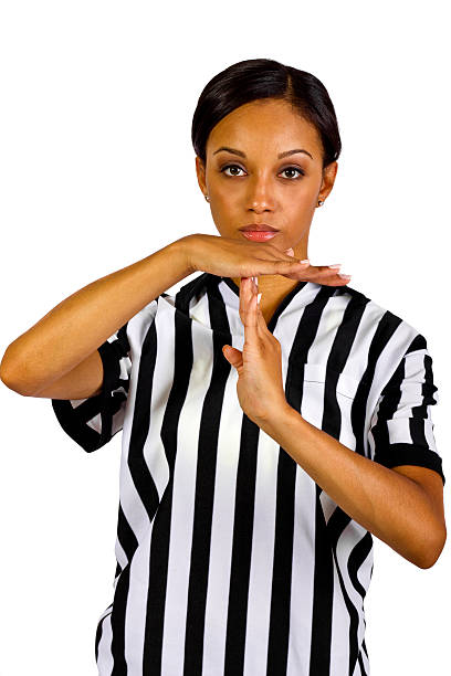 Black Female Referee Using Hand Signals for Time Out young African American female referee with hand signals.  isolated on a white background. referee stock pictures, royalty-free photos & images