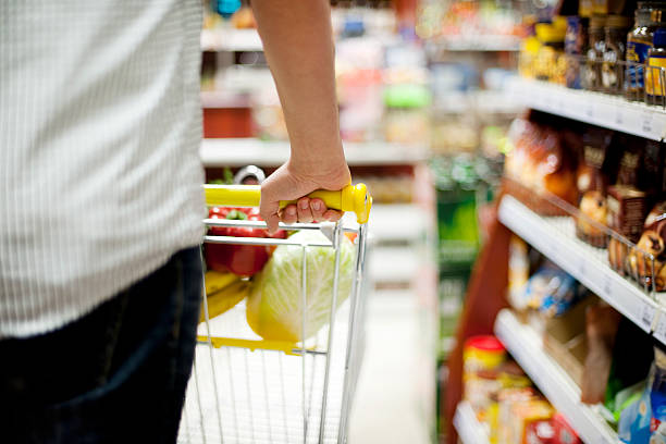 istock Man pushing shopping trolley 163213483