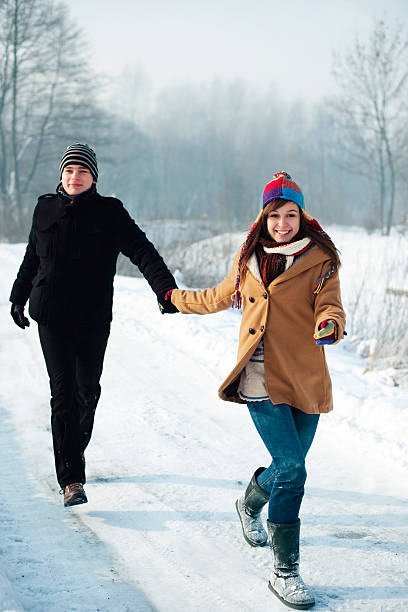 istock Young couple running through the park 163213571