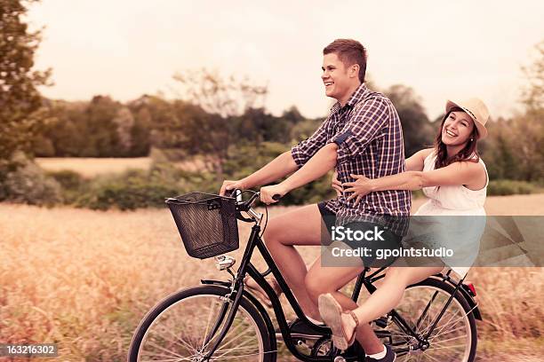 Couple Have Fun Riding On Bike Stock Photo - Download Image Now - Bicycle, Couple - Relationship, Cycling