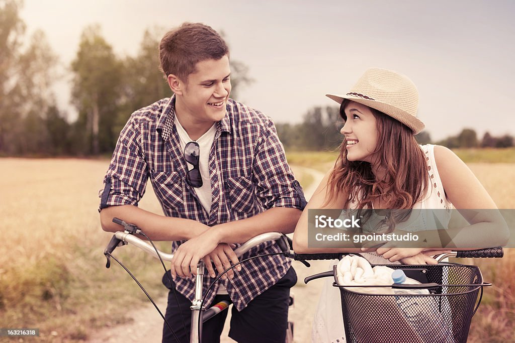 Portrait of happy couple on bicycles 20-29 Years Stock Photo
