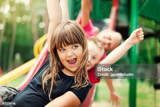 Kids Having Fun On Slide Stock Photo - Download Image Now - Child, Slide - Play Equipment, Sliding