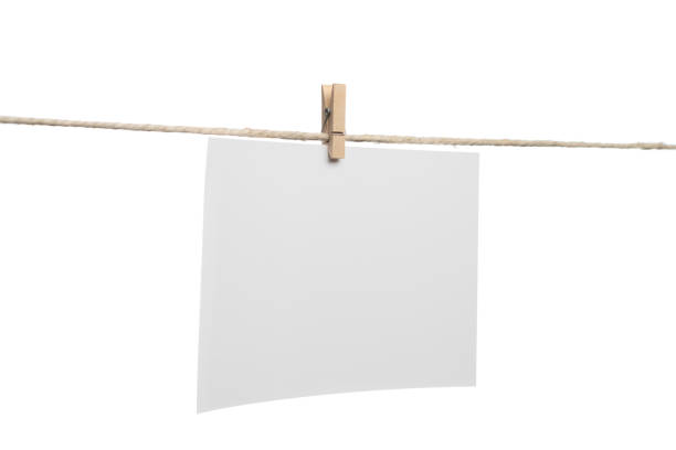 istock White blank photo card hanging on clothesline 1632164184
