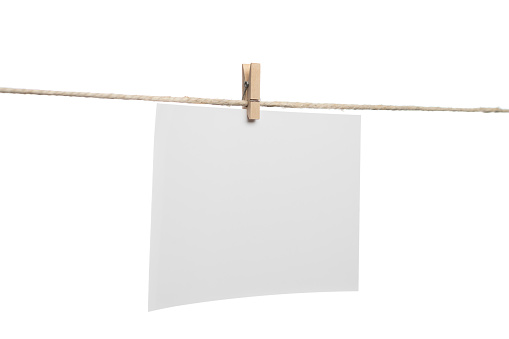 White blank card with on rope isolated on white background.  Image taken with tilt-shift lens for perspective control