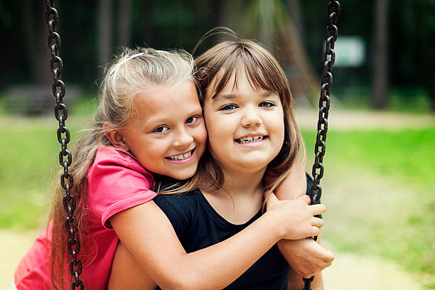 istock Best friends swinging in a park 163216506