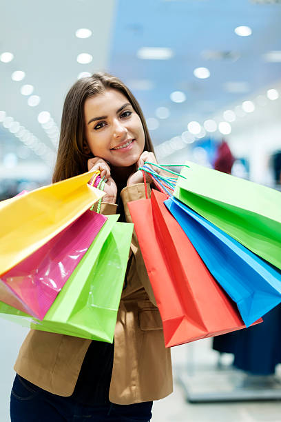 istock Young woman with shopping bags 163216528
