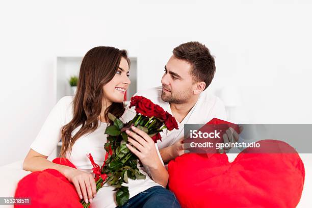 Smiling Couple Celebrating Valentines Day Stock Photo - Download Image Now - 20-29 Years, Adult, Adults Only