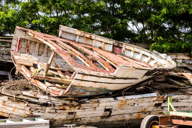istock Old and broken wooden boat stranded 1632185878