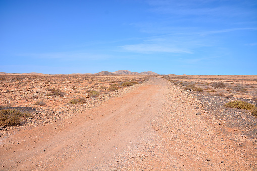 Dirt road to the rocky ridge line known as the Great wall of China due to its resemblance to the original on the Flinders Ranges, the largest mountain ranges in South Australia.