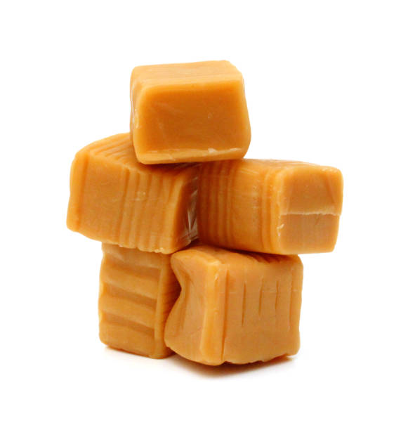istock Caramel candies isolated on white background 1632191484