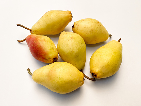 Fresh organic pears on white background